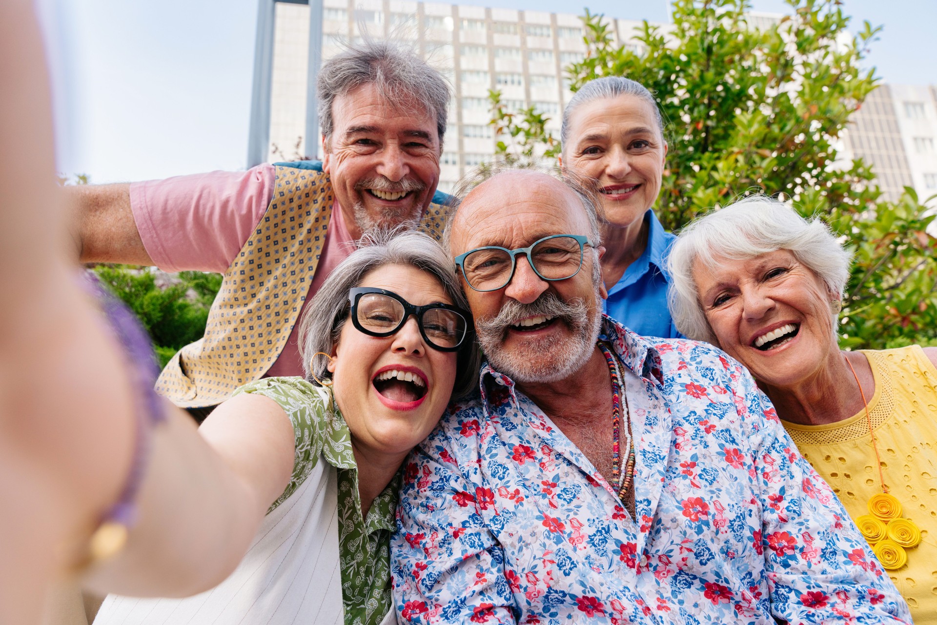 Group of senior friends meeting outddors in the city and having fun - Cheerful old people bonding together, concepts about elderly, quality of life and aging lifestyle